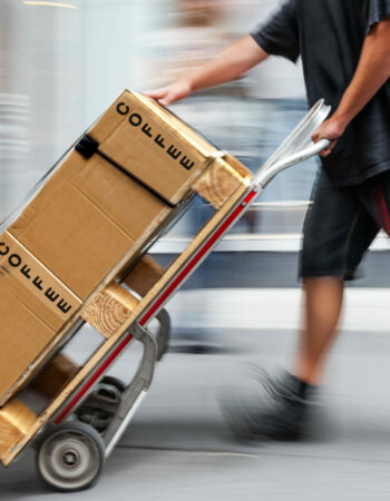 delivery goods with dolly by hand, purposely motion blur